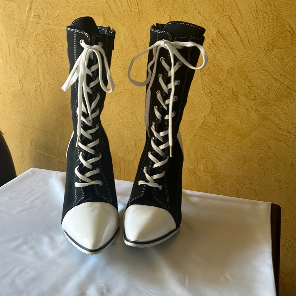 Black and white high heel boots.